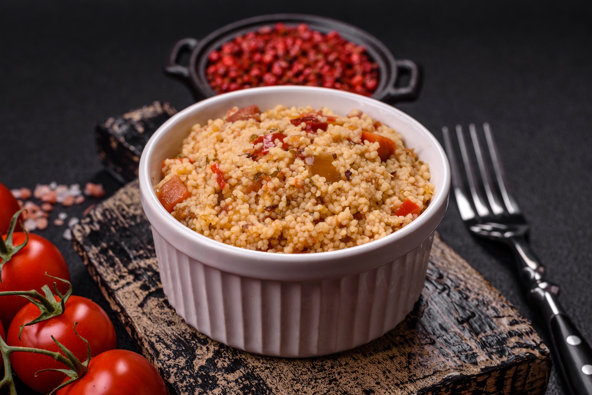 Delicious hot boiled wheat porridge couscous with vegetables