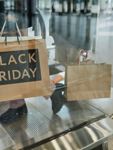 Woman Holding Black Friday Shopping Bags