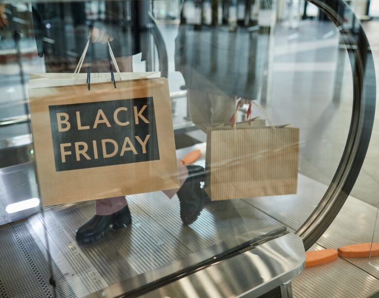 Woman Holding Black Friday Shopping Bags
