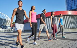 Young sport team walking in line along paved area